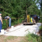 Volunteers installing side-railing on Bowie Co s famous Holy Bridge 2009